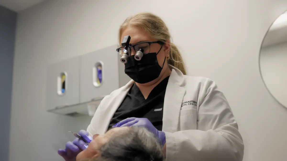 Dentist providing focused clinical care